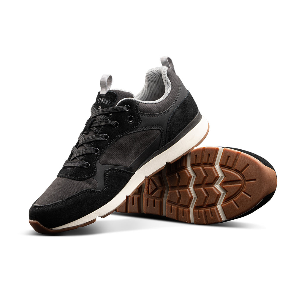 Pair of Ridgemont Escape sneaker in color Black. Propped shoe shows black oiled suede, black canvas, black ripstop poly, black laces, white CMEVA midsole and grey inner lining. Shoe on side shows real rubber gum colored tread with study grip. Outdoor shoe, everyday sneaker, comfortable pair of shoes, Ridgemont x comfort, everyday sneakers, everyday shoes.