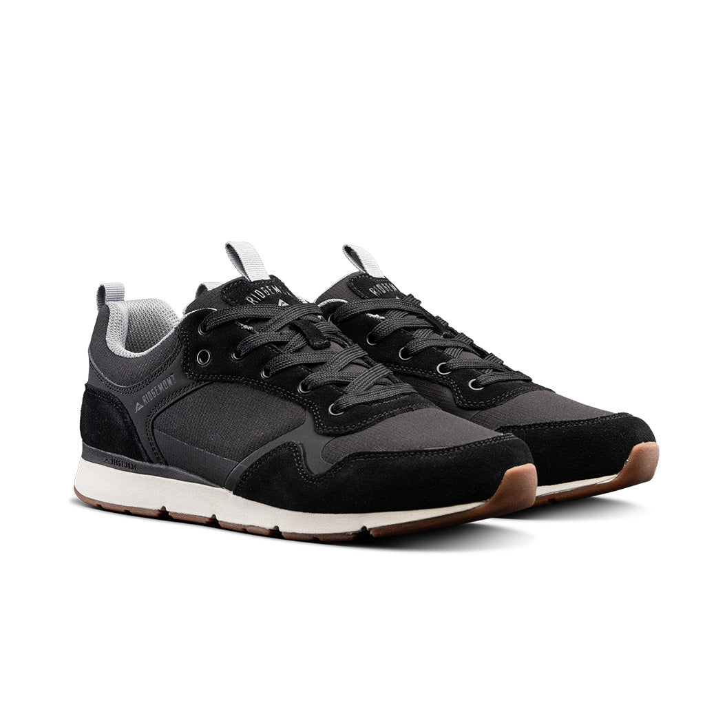 Pair of Ridgemont Escape sneaker in color Black showing black laces, grey inner lining, gum colored real rubber tread, micro ripstop poly, oil suede. Outdoor sneaker, sneakers, outdoor shoes, shoes.