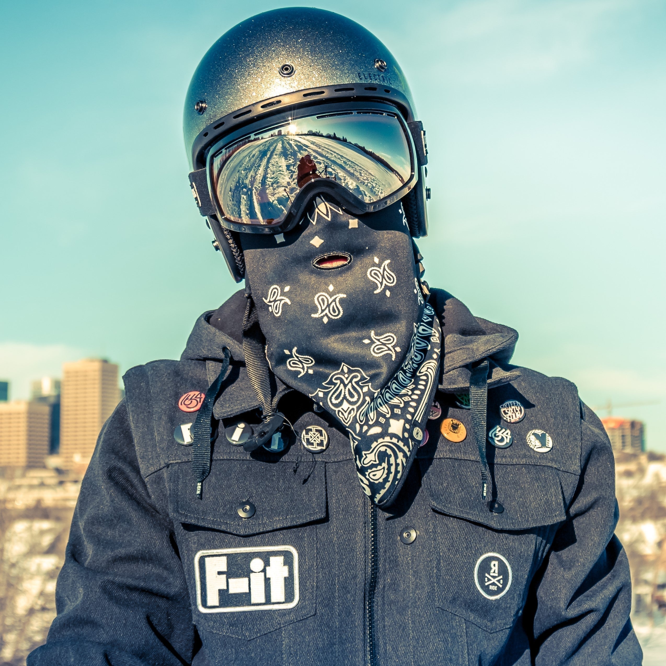 Dustin Cyganik Snowbiker in helmet and snow goggles 