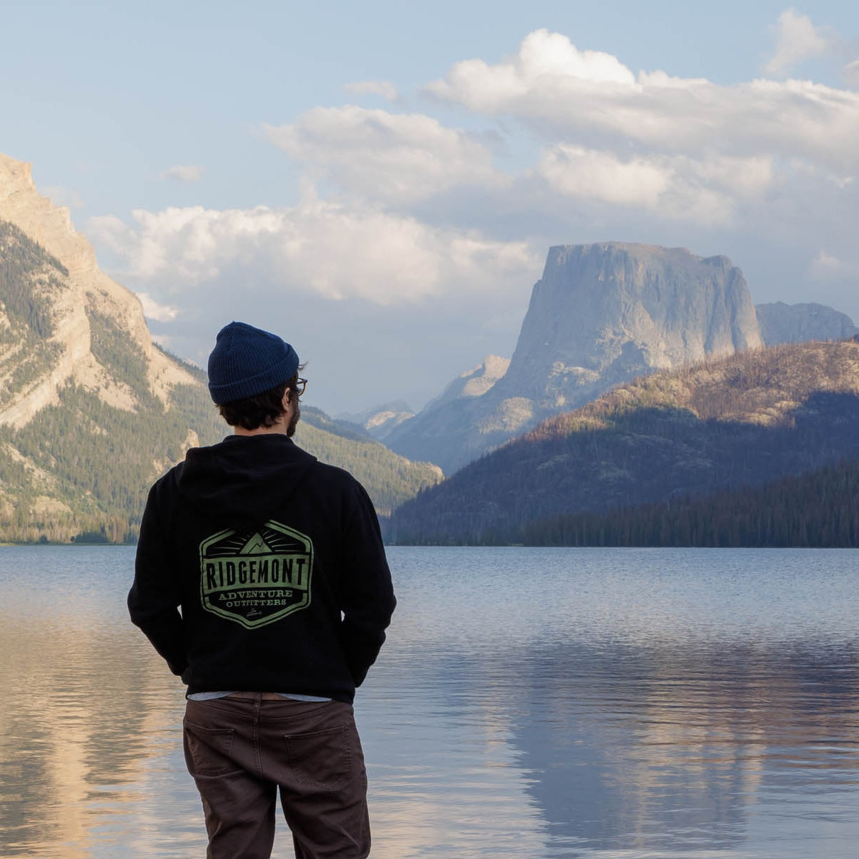 Jerrick Romero in the Ridgemont  Crater Zip Hoodie looking at Square Top Mountain in Wyoming 