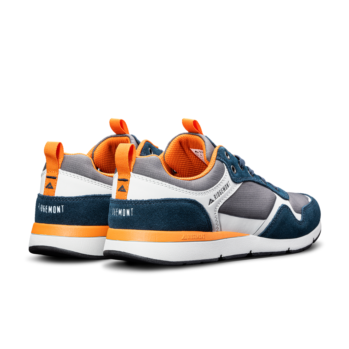 Ridgemont Escape shoe sneaker in color Navy Charcoal heel cross side view. Shoe is made with grey/gray micro ripstop poly, navy oiled suede, navy laces, orange inner lining, DWR coating, white and orange CMEVA midsole, real rubber tread in color black. Ridgemont sneaker, outdoor shoe, everyday shoe, everyday sneaker, comfort, nature, comfort, comfortable. Perfect for adventure, outdoors, outside, nature. Independent footwear brand.