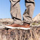 Pair of Ridgemont Outback boots being actively worn lifestyle outside in Utah. Shows brown laces, full grain leather, cream (off white) foxing, and ready for adventure! Outdoor boots, outdoor boot, outdoor shoes, outdoor shoe.