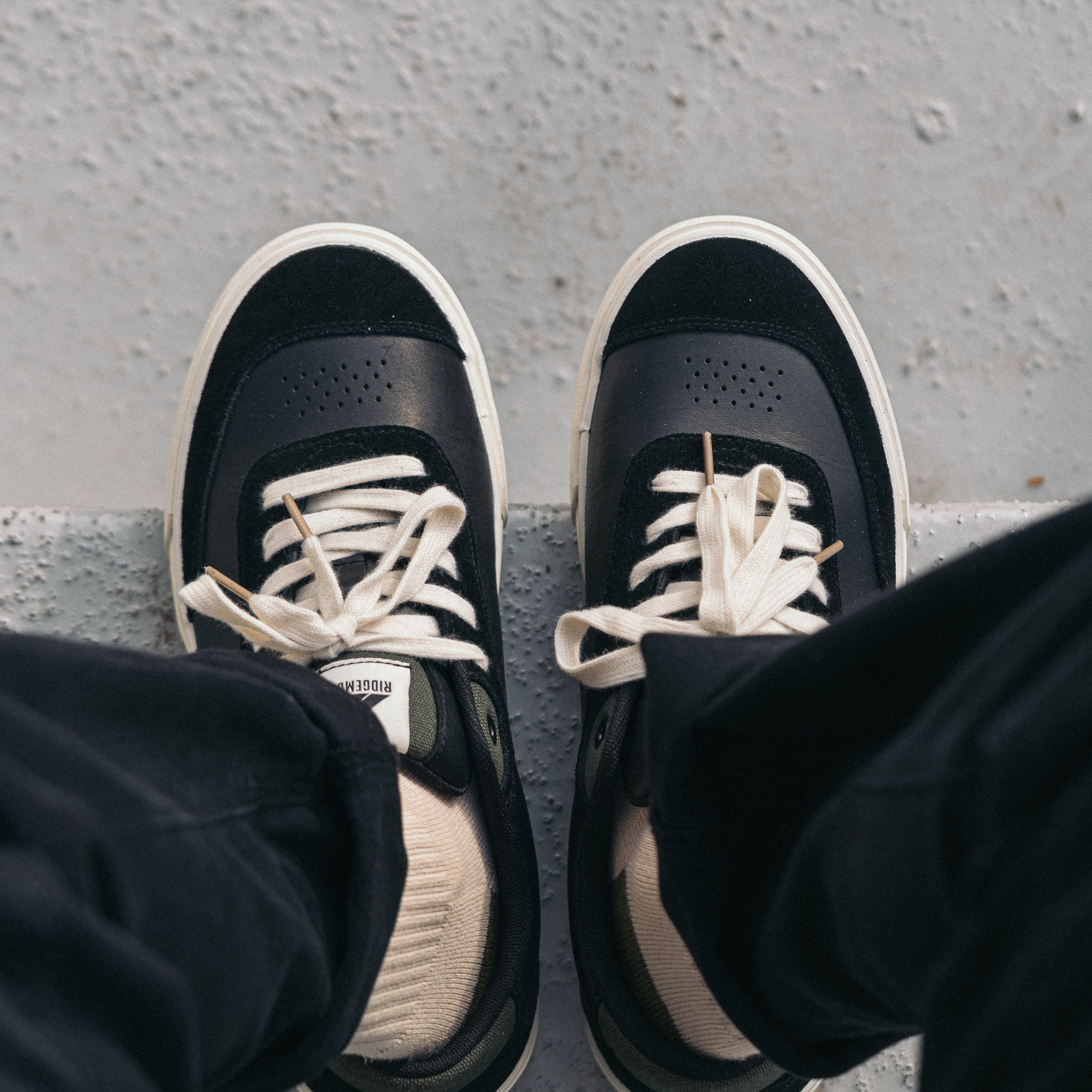 Ridgemont Flint skate shoe in Black Olive showing top view asymmetrical suede toe caps, ollie pads.