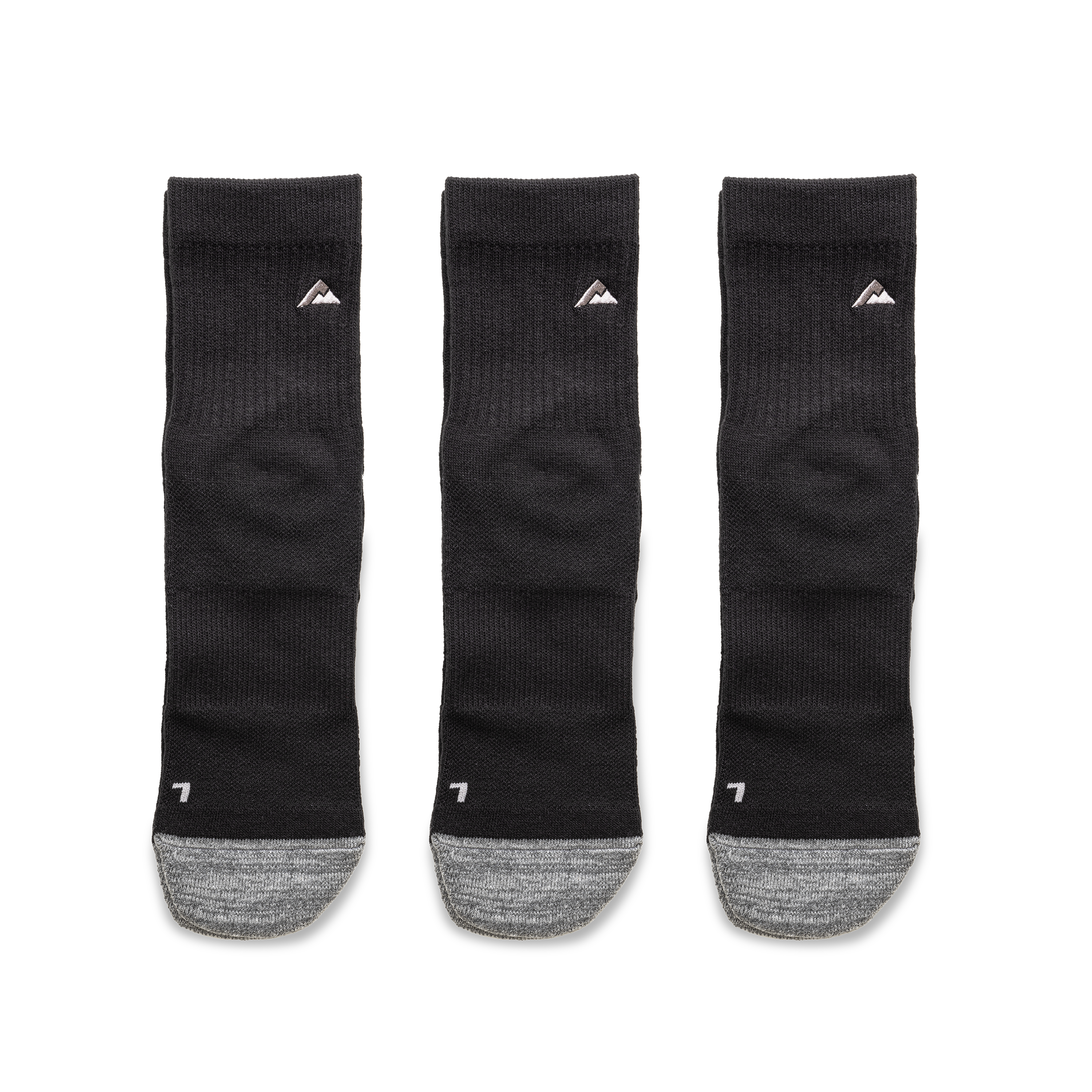 Ridgemont Staple Quarter Black 3 Pack with gray heels and toes, arranged side by side on a white background. Each sock features a small white mountain logo near the top and a white letter 7 near the heel.