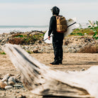 Surfer wearing Ridgemont Black Gum Monty standing at San Onofre beach looking at surf